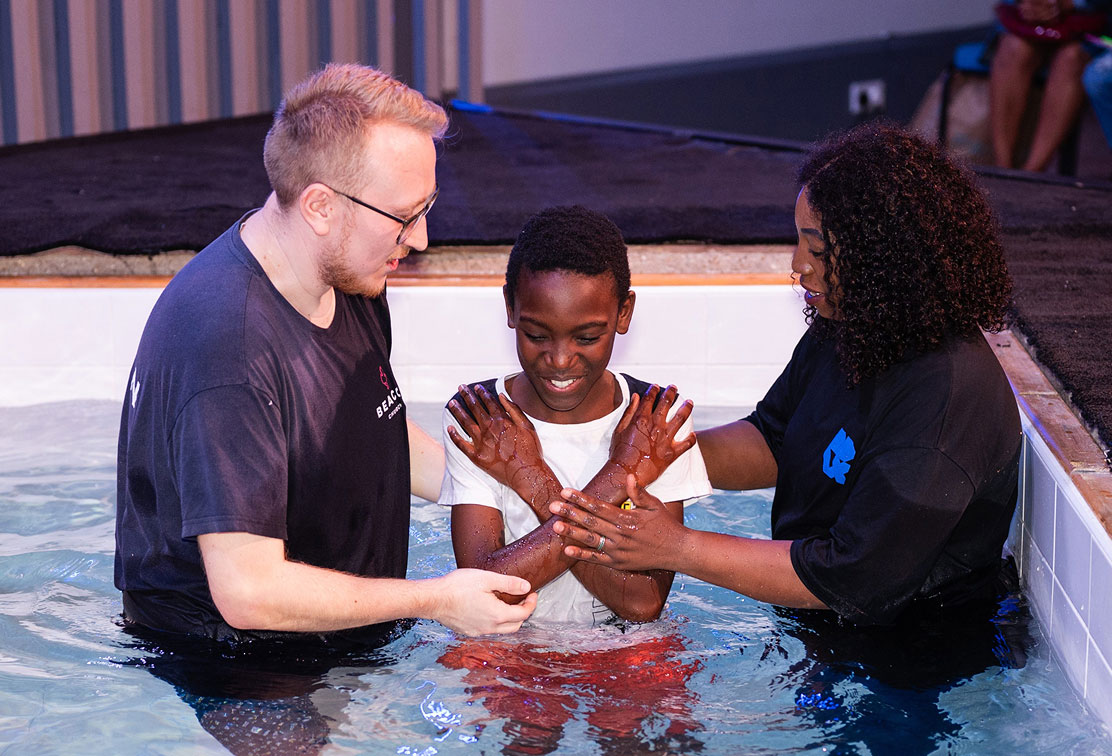 Young boy being baptised at Beacon Church