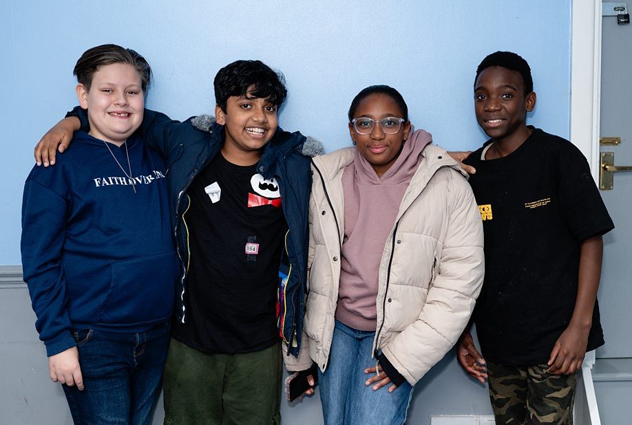 Group of Beacon Church youth shoulder to shoulder