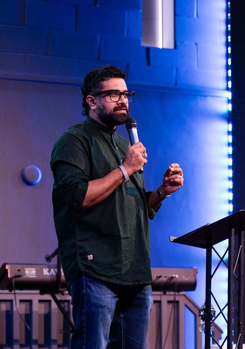 Speaker delivering a message at a church service in Bury St Edmunds, Suffolk.