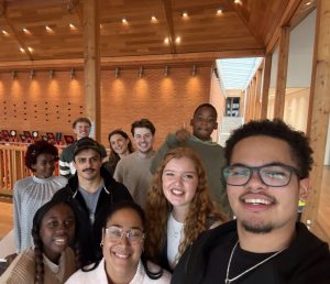 Diverse group of young adults smiling together at a church community gathering in Bury St Edmunds, Suffolk