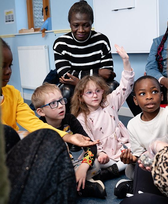 Children engaging in a group discussion with leaders during a church kids session in Bury St Edmunds, Suffolk