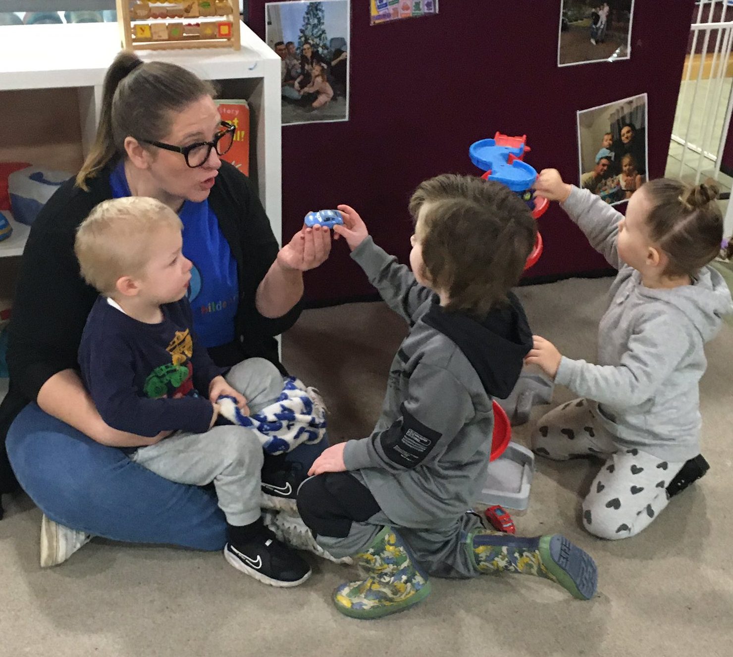 A church worker playing with toddlers during a children’s session at a church in Bury St Edmunds, Suffolk.