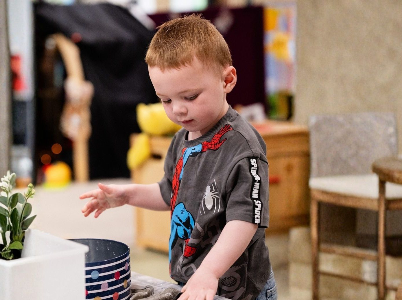 Toddler playing in a church children’s area during a service in Bury St Edmunds, Suffolk
