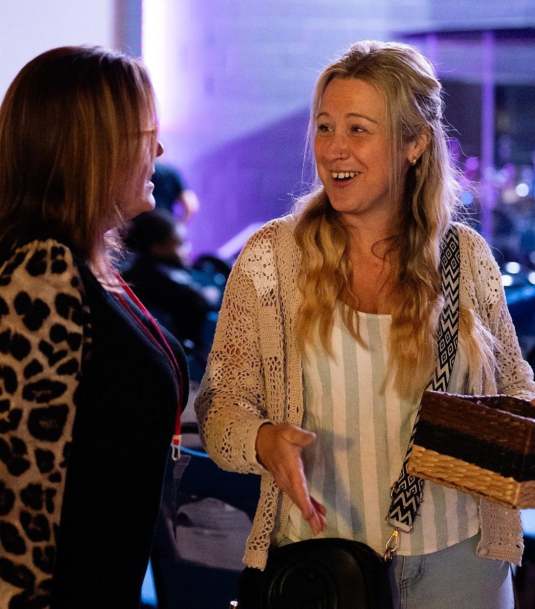 Two women talking at a church gathering in Bury St Edmunds, Suffolk.