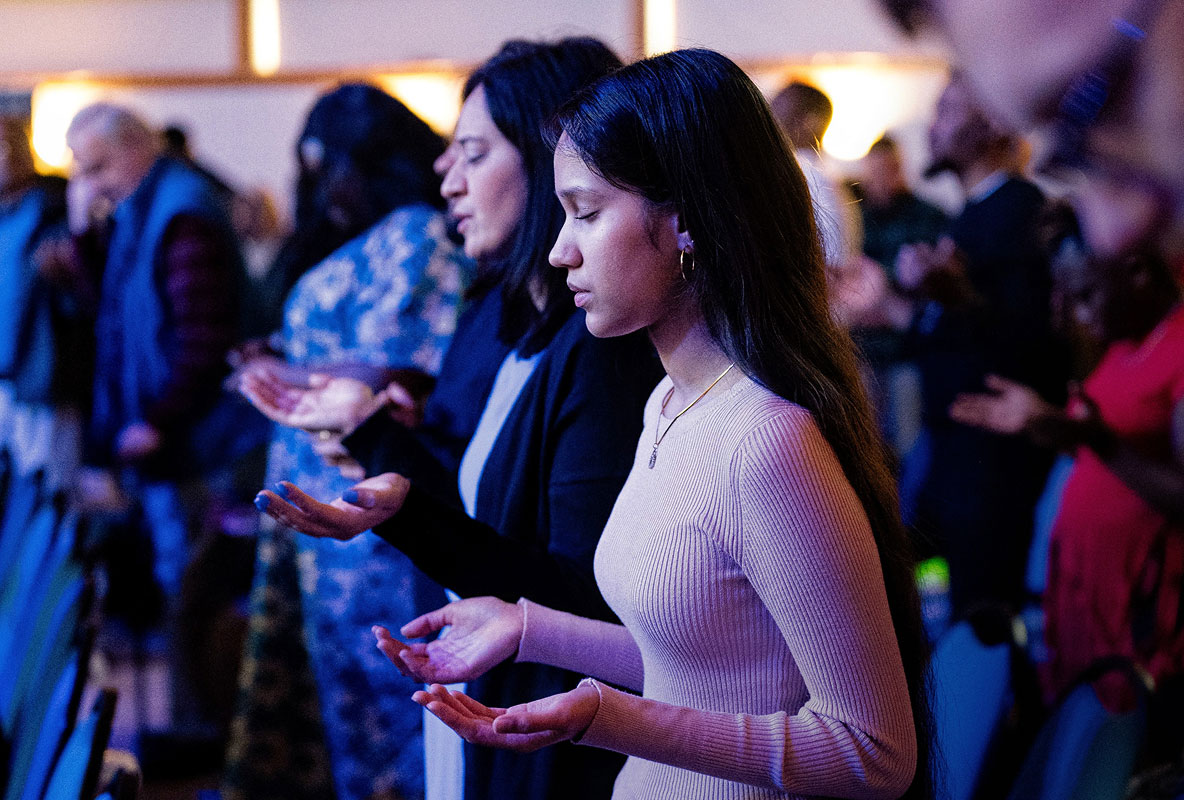 People worshipping during a church service in Bury St Edmunds, Suffolk.