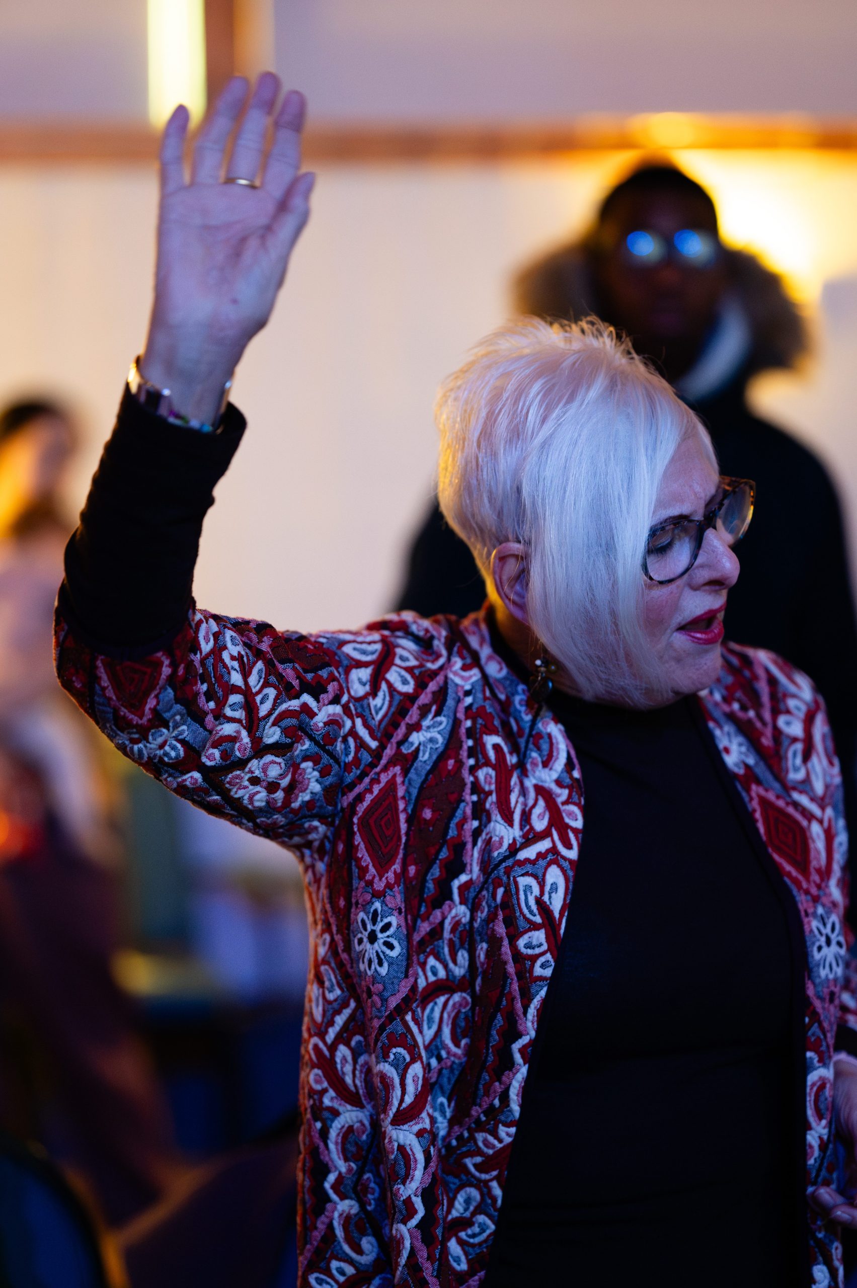 A woman worshipping during a church service in Bury St Edmunds, Suffolk. Caption