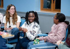 Young people chatting and building friendships at a church youth group in Bury St Edmunds, Suffolk