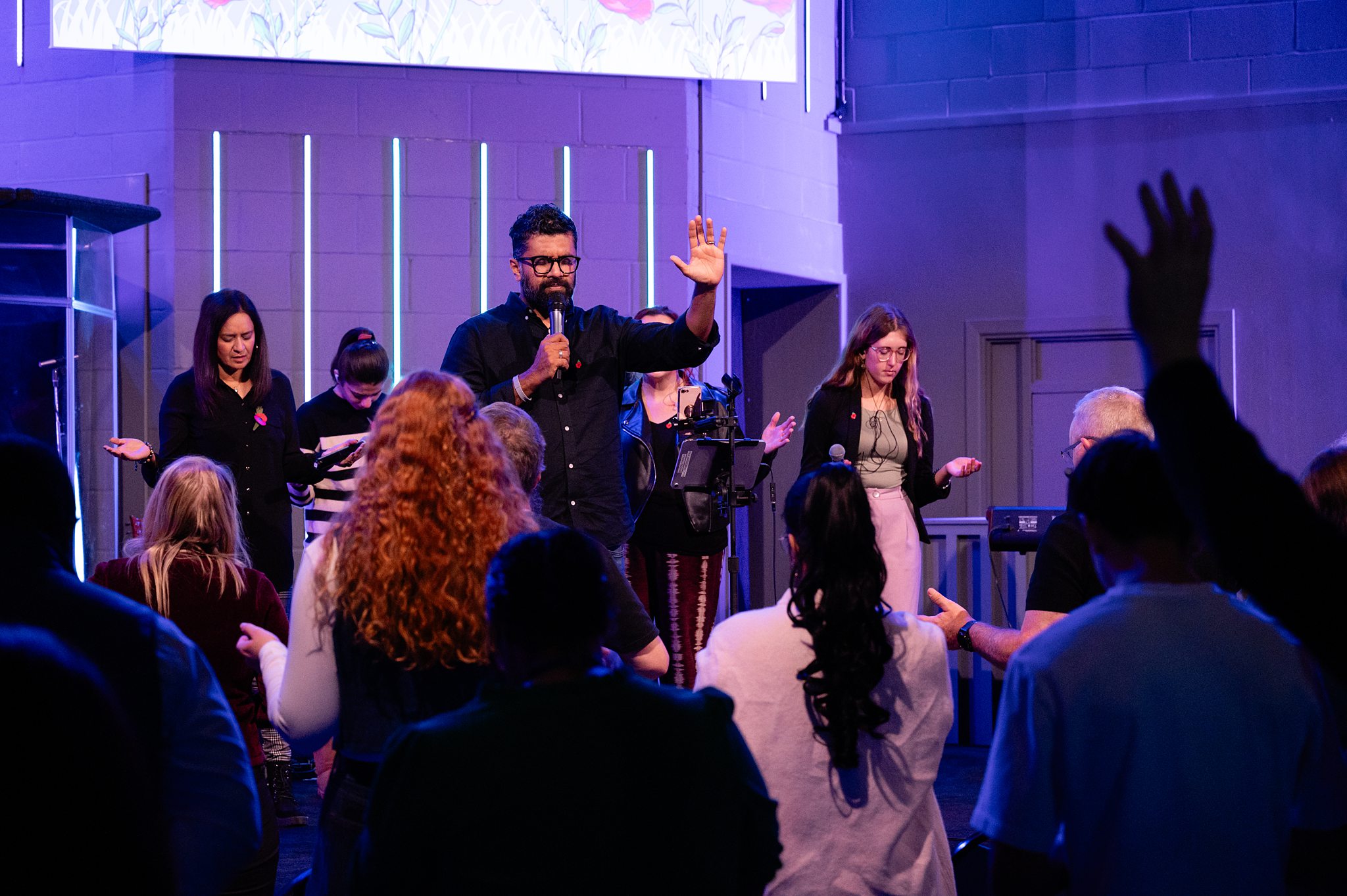 “People praying and worshipping together during a church service in Bury St Edmunds, Suffolk”