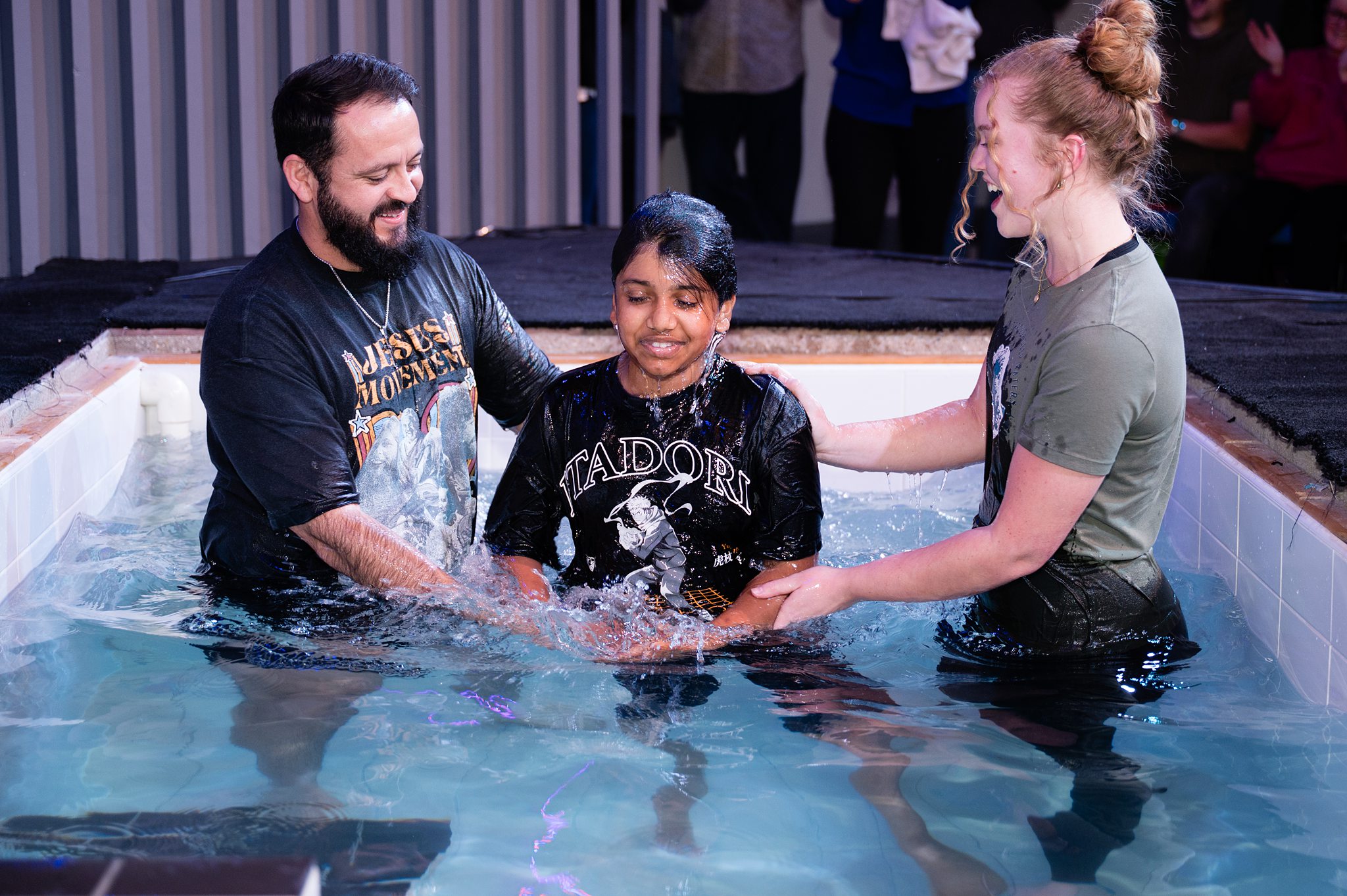 “Young person being baptised during a water baptism service at Beacon Church in Bury St Edmunds Suffolk”