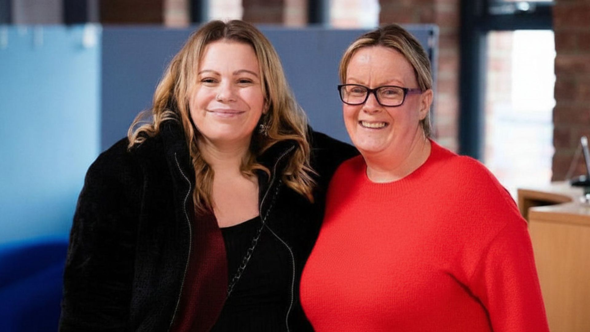 Two women smiling together at a Beacon Church gathering in Bury St Edmunds, Suffolk, showcasing the welcoming community and friendly atmosphere of a local church connecting people through faith and friendship.