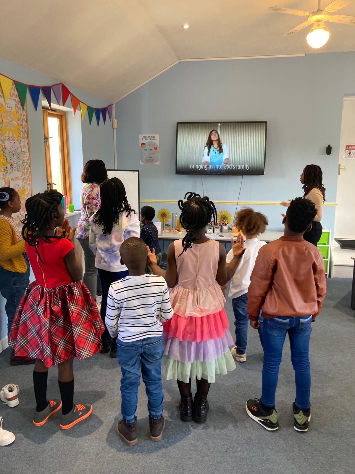 Children participating in worship and learning during a Beacon Kids session at Beacon Church in Bury St Edmunds, Suffolk, engaging in faith-filled activities designed for young families and children.